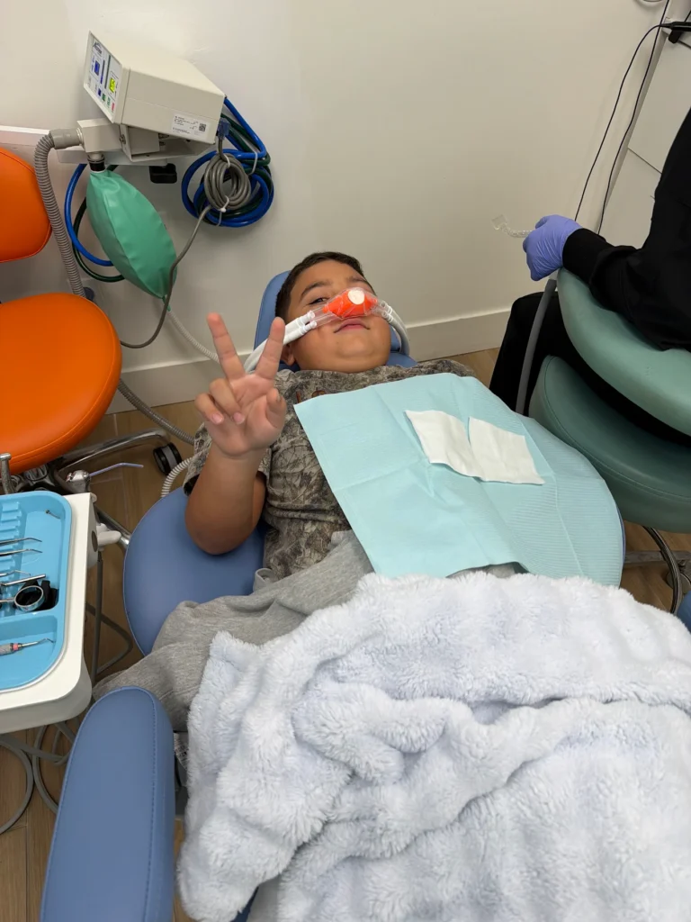 Pediatric dentist treating a child at Say Cheese Kids Dental in Chino, CA